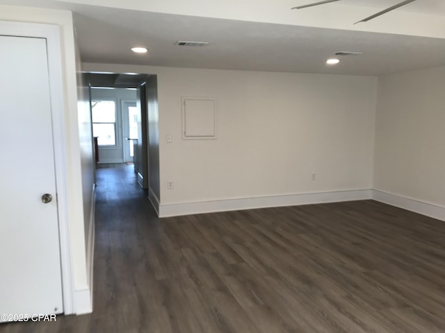 spare room with dark hardwood / wood-style floors