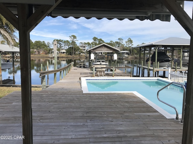 view of swimming pool featuring a dock and a water view