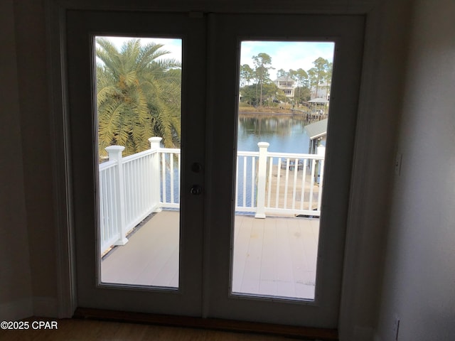 entryway with a water view and french doors