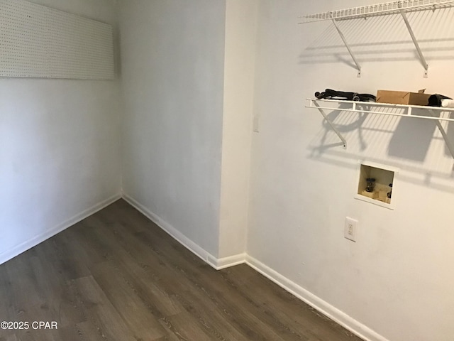 clothes washing area with dark hardwood / wood-style flooring and washer hookup