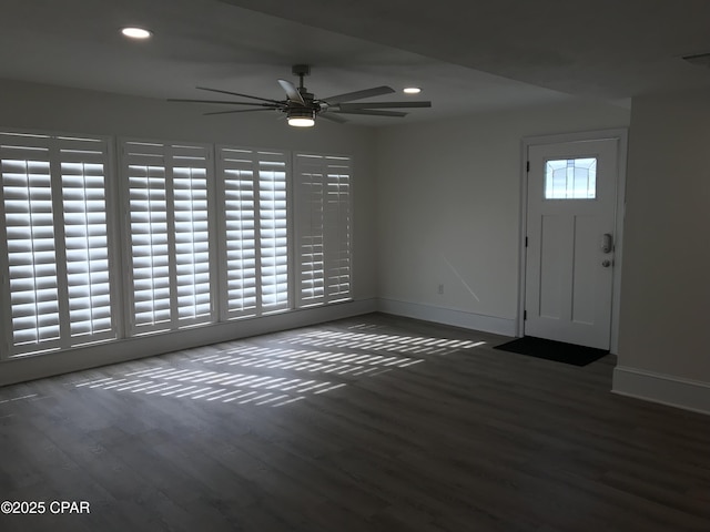 foyer featuring ceiling fan and dark hardwood / wood-style floors