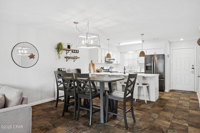 dining space featuring sink