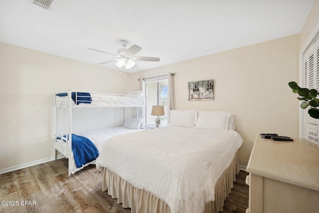 bedroom with ceiling fan and hardwood / wood-style floors