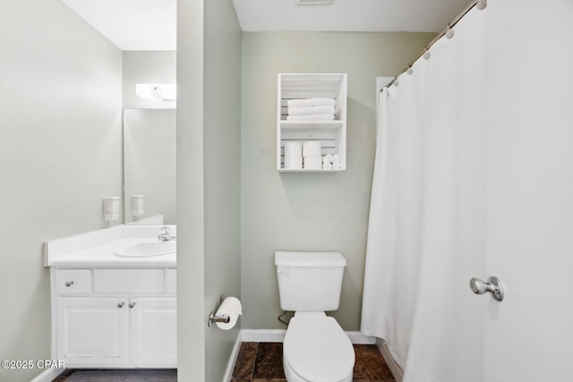 bathroom with toilet and vanity