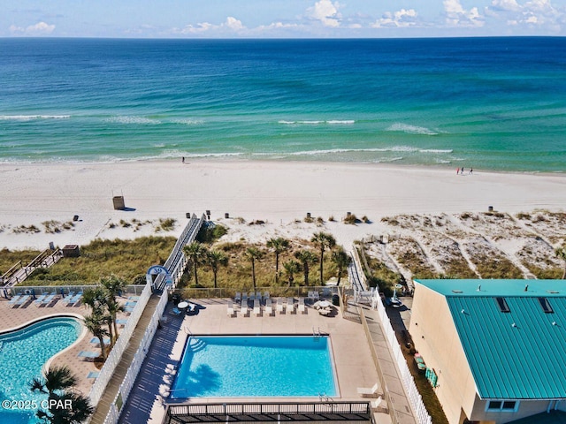 bird's eye view featuring a beach view and a water view