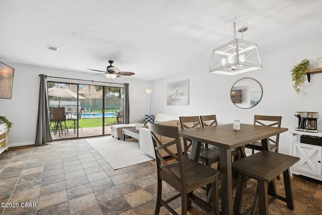 dining space with ceiling fan