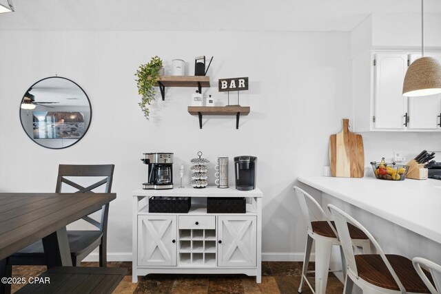 bar featuring white cabinetry