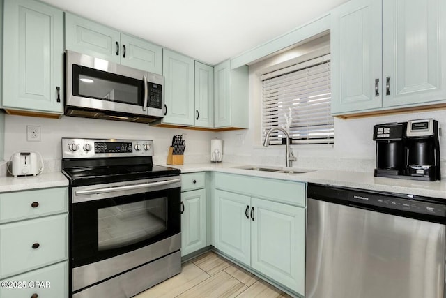 kitchen with sink and appliances with stainless steel finishes