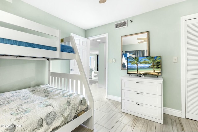 bedroom featuring ceiling fan and a closet