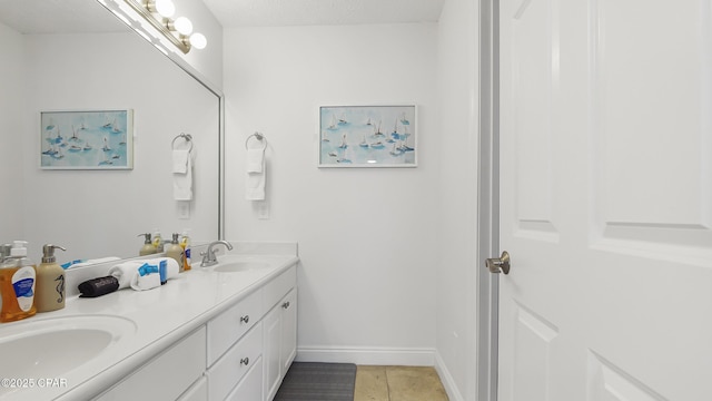 bathroom with vanity and tile patterned flooring