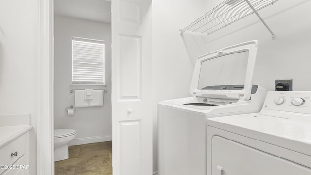 laundry room with washer and clothes dryer