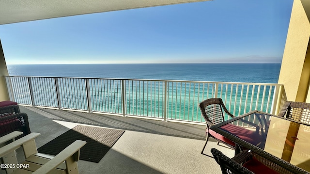 balcony featuring a water view