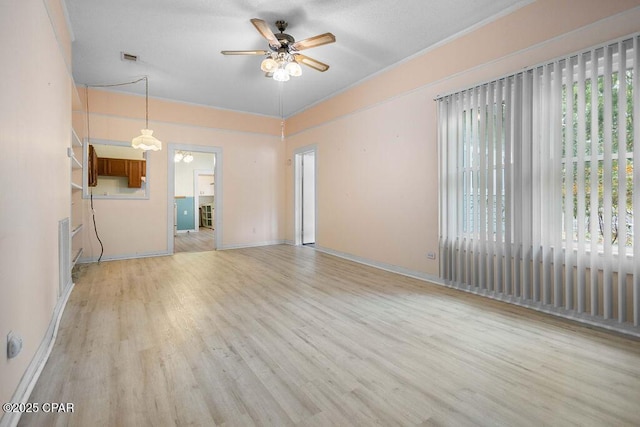 unfurnished living room featuring baseboards, ceiling fan, and light wood-type flooring