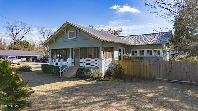 view of front of property with a sunroom