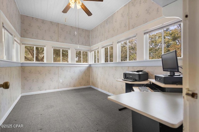 carpeted office space featuring ceiling fan