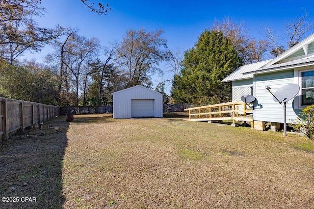 view of yard with an outbuilding and a garage