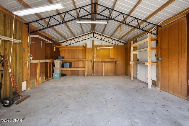 garage featuring wooden walls