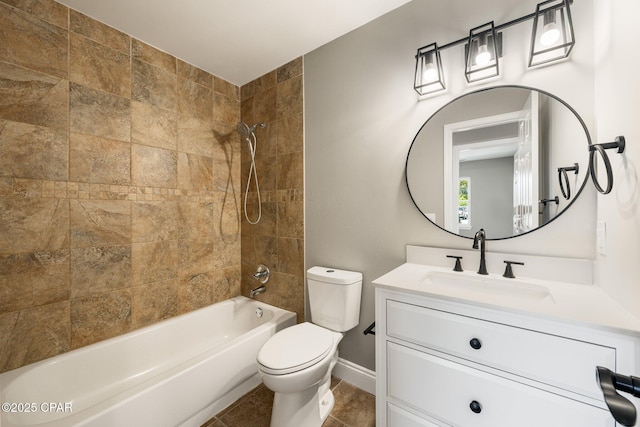 full bath featuring toilet, vanity, baseboards, tub / shower combination, and tile patterned floors