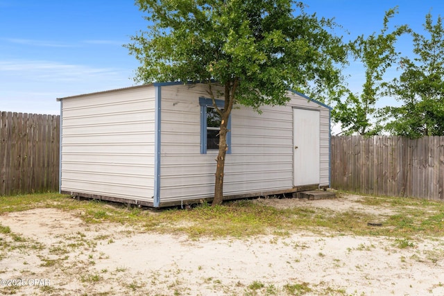 view of shed featuring a fenced backyard