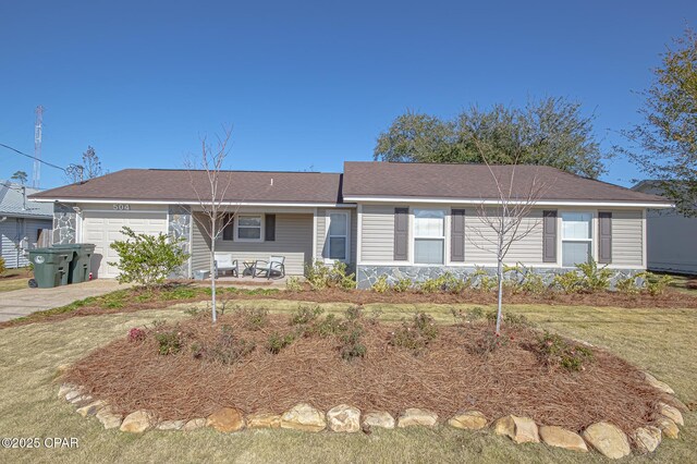 ranch-style house with a garage and a front yard