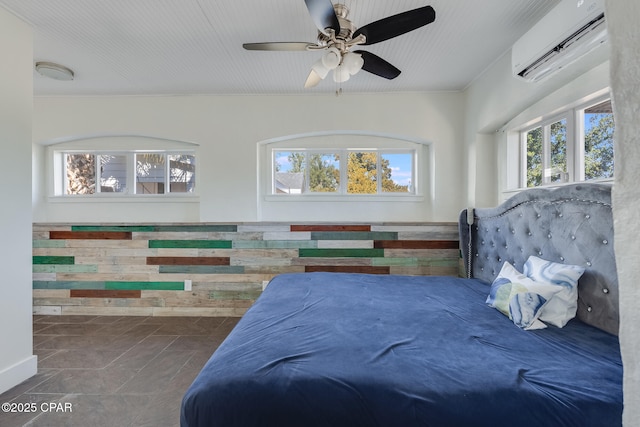 bedroom featuring an AC wall unit, ceiling fan, and dark tile patterned flooring