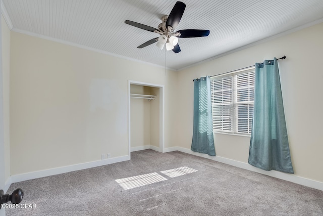 unfurnished bedroom featuring ceiling fan, light colored carpet, ornamental molding, and a closet