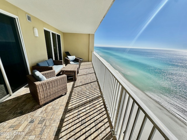 balcony with a view of the beach and a water view