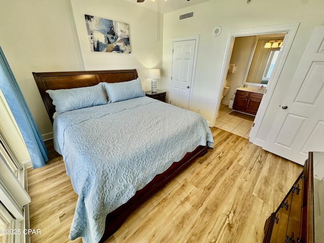 17643 Front Beach Rd Unit 1806, Panama City Beach, FL 32413 - bedroom featuring baseboards, light wood finished floors, ensuite bathroom, and visible vents