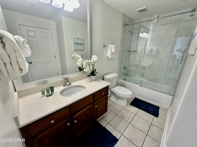 full bathroom featuring toilet, vanity, tile patterned floors, enclosed tub / shower combo, and a textured ceiling