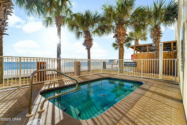 17643 Front Beach Rd Unit 1806, Panama City Beach, FL 32413 - view of swimming pool featuring a community hot tub, fence, a water view, and a patio