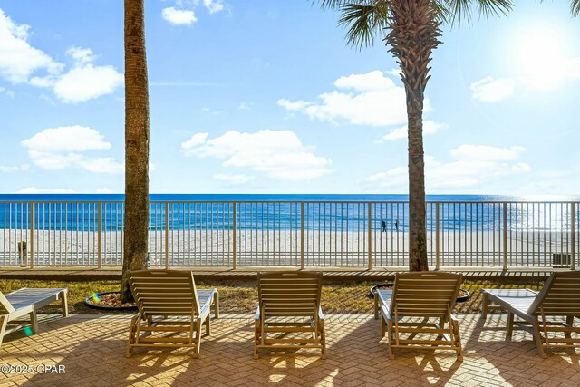 17643 Front Beach Rd Unit 1806, Panama City Beach, FL 32413 - view of patio with fence, a view of the beach, and a water view