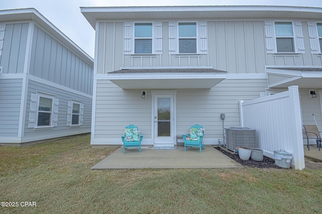 rear view of property with a patio area, a lawn, and central air condition unit