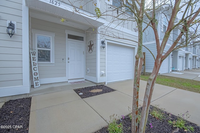 doorway to property featuring a garage