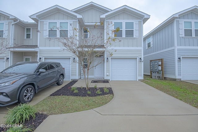 townhome / multi-family property with a garage