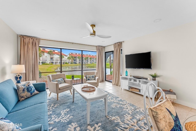 living room featuring light tile patterned floors and ceiling fan