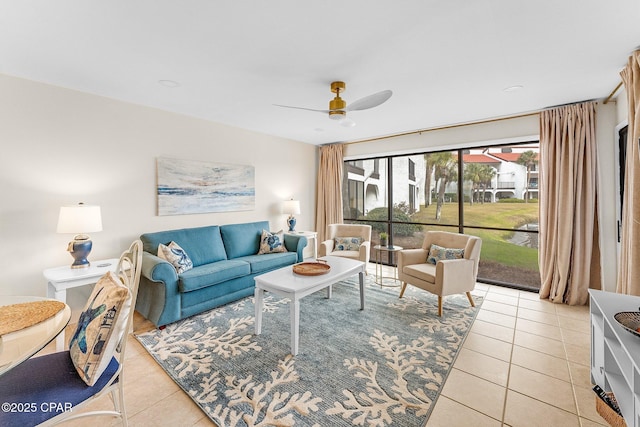 tiled living room with ceiling fan