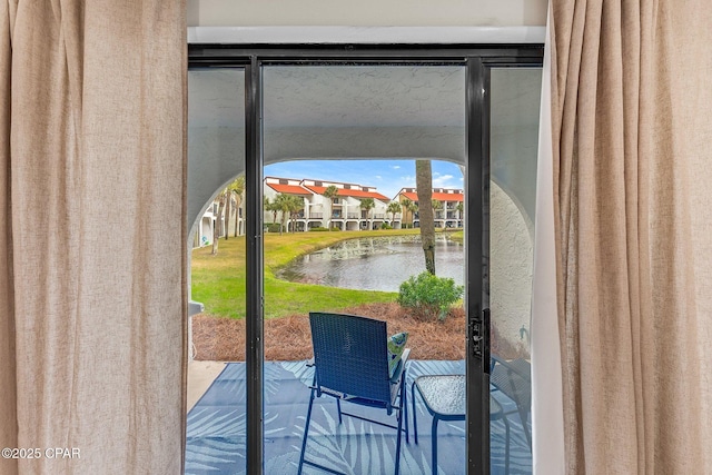 doorway featuring a water view