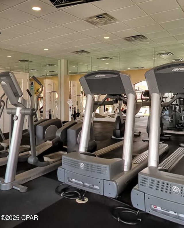 workout area with a drop ceiling