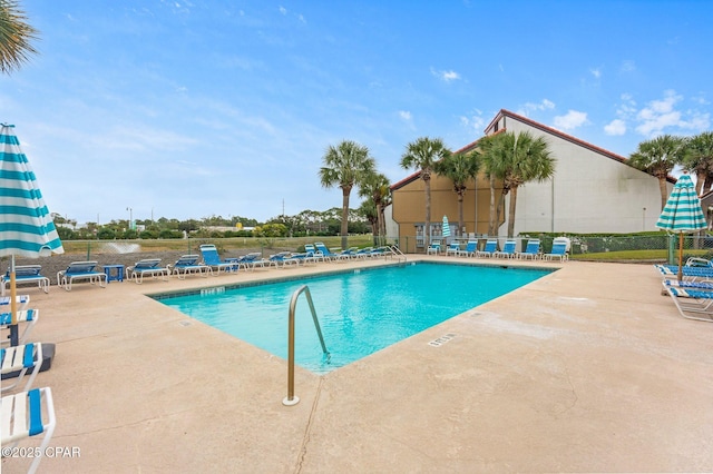 view of swimming pool with a patio