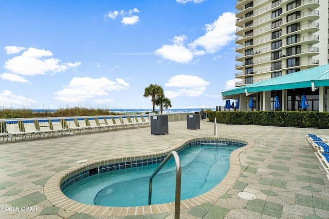 view of swimming pool featuring a patio area