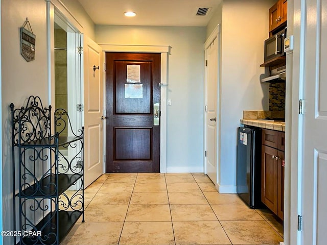 interior space with light tile patterned flooring