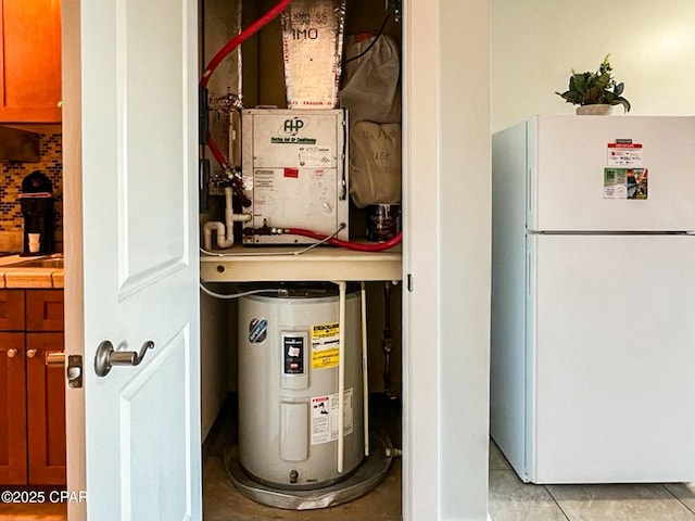 utility room featuring electric water heater