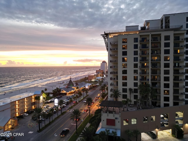 view of city featuring a water view and a beach view