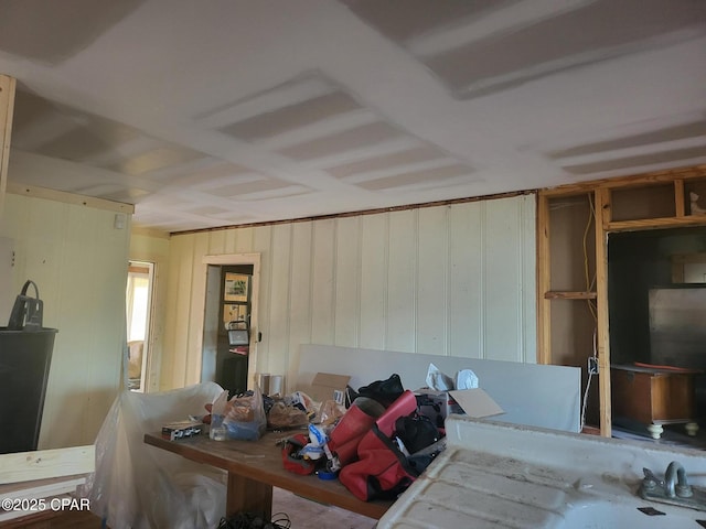 misc room with wood walls