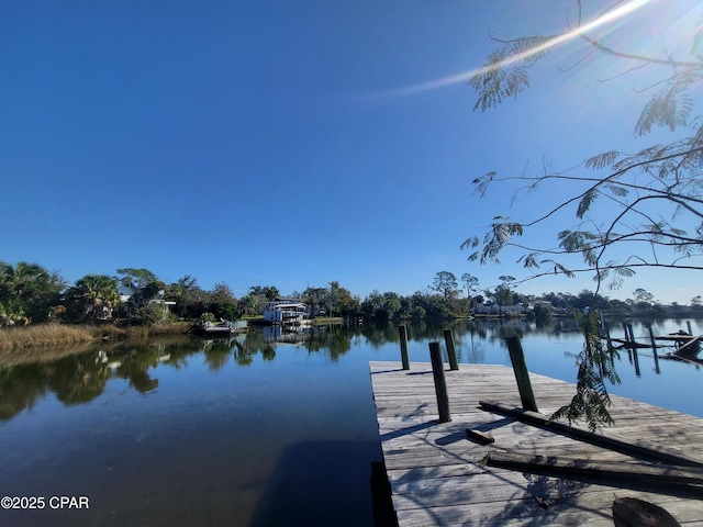 property view of water featuring a dock