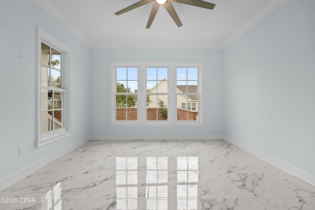 spare room featuring ceiling fan, a wealth of natural light, and crown molding