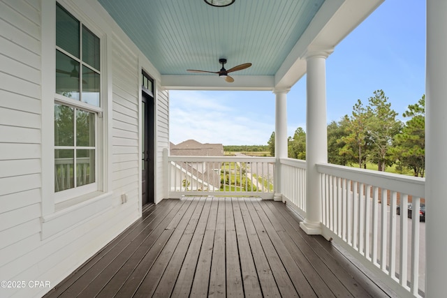 deck with a porch and ceiling fan