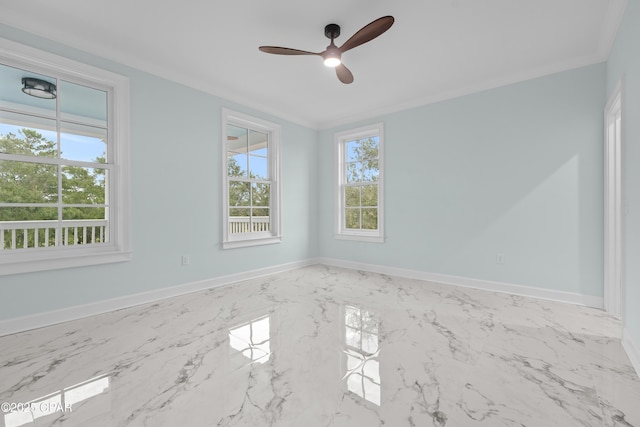 empty room featuring ornamental molding and ceiling fan