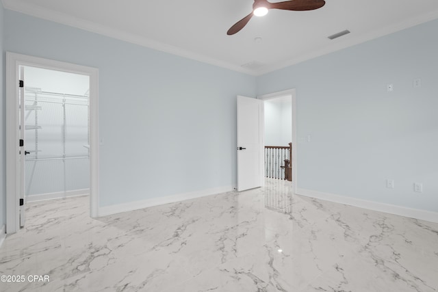 unfurnished room with ornamental molding and ceiling fan