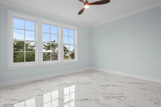 empty room with ornamental molding and ceiling fan